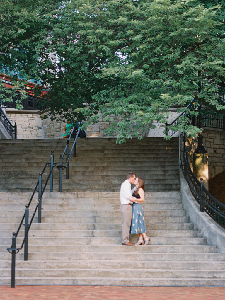 couple kissing on stairway